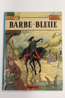 un livre sur lequel figure l'image d'un homme à cheval