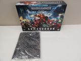 a box of warhammers and a plastic model of a warhammer