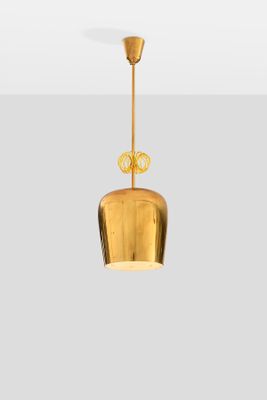 an image of a gold pendant light hanging from the ceiling