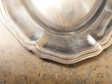 a silver plate that is sitting on a table