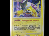 a close up of a pokemon card on a black background