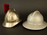 two helmets sitting next to each other on a table