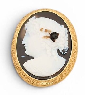 an image of a woman ' s profile in a black and white cameo broochle