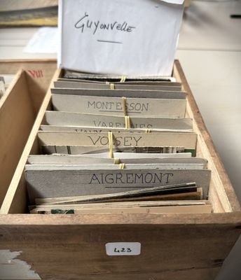 a wooden box filled with lots of different types of cards