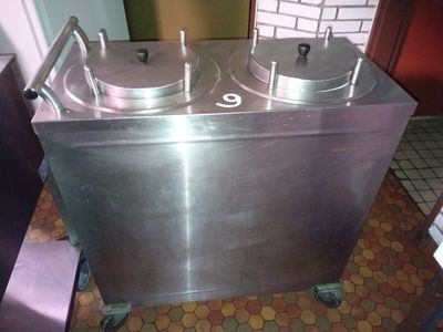 a stainless steel container with two pans on top of it