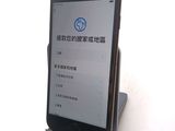 a cell phone that is sitting on a stand