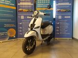 a scooter that is parked in a showroom