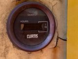 a close up of a meter on the side of a building