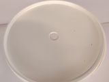 a white bowl with a hole in the middle of it