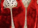 silverware in a velvet box with a red velvet lining