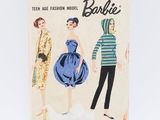 an image of a box of barbie paper dolls on a white surface