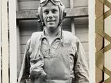 a black and white photo of a man wearing a helmet and goggles