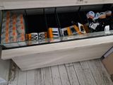 a glass display case filled with candy and candy bars