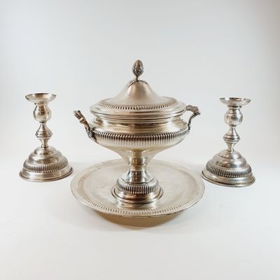 silver plated tea set with two cups and a saucer on a tray