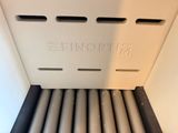 a close up of a radiator with the word shinopm written on it