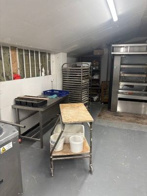 an image of a commercial kitchen with a lot of cooking equipment