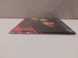 a dvd sitting on a table with a blurry background