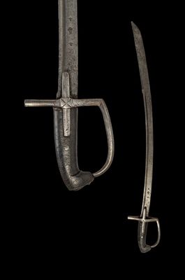 a close up of a knife and a sword on a black background