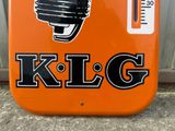 an orange sign that says klg with a microphone on it