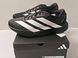 the black and white adidas shoes are on top of a box