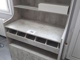 a shelf that has a lot of drawers in it