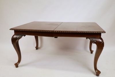 an image of a wooden table with two leaves on it
