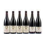 six bottles of red wine lined up in a row