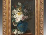 painting of flowers in a blue vase on a table