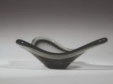 a black and white glass bowl sitting on a white surface