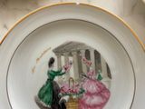 a plate with a picture of a woman and a man on it