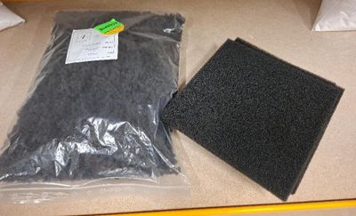 a black sponge pad and a black sponge pad on a counter