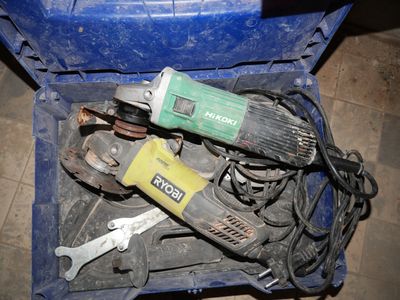 a blue box with tools in it on the floor