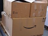 boxes stacked on top of each other on a pallet in a warehouse