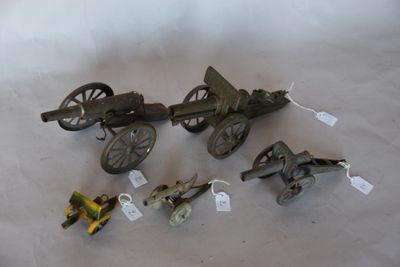 several small metal objects are sitting on a white surface