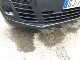 a black car with a license plate on the front of it