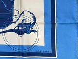 blue and white scarf with a picture of a horse drawn on it