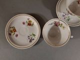 three cups and saucers are sitting on a table