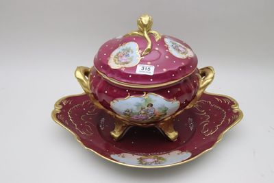 a red and gold bowl and saucer on a saucer