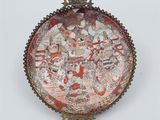 an image of a decorative plate with a picture of people on it