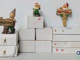 three gnomes that are standing on a stack of boxes