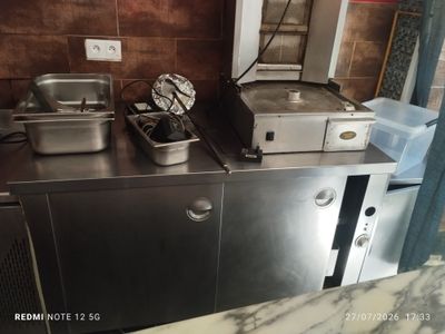 a kitchen with a lot of food on the counter