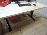 a desk with a computer, keyboard, mouse, and printer on it