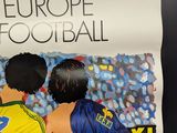 a poster of a couple of soccer players on the wall