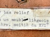 a label on a piece of luggage that has been left on the floor