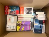 a box full of books that are sitting on the floor