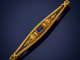 an image of a gold and blue stone broochle