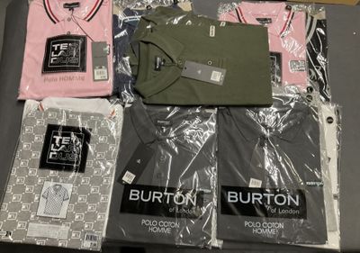 a lot of t - shirts that are on a table
