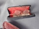 a pair of glasses sitting in a case on a table
