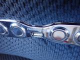 an image of a close up of a button on a seat