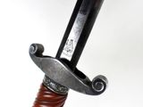 a close up of a sword with a metal handle